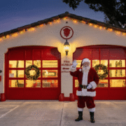 Santa Claus standing in front of the Fort Lauderdale Fire and Safety Museum